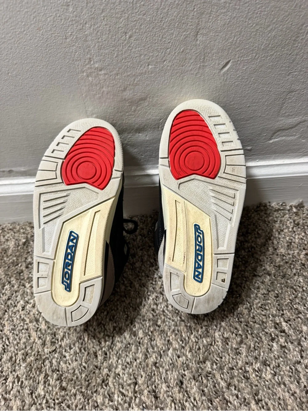 Nike Kids Black and Cream Sneakers with Blue and Red Accents